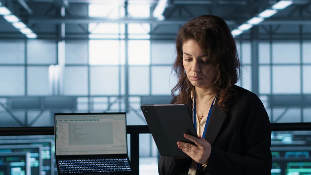 Professional reviewing a cloud dashboard on a tablet
